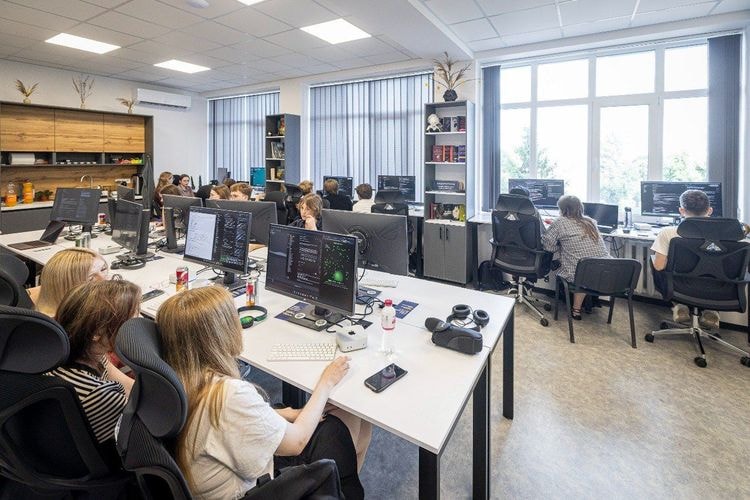 Hackathon participants working at computers in the laboratory