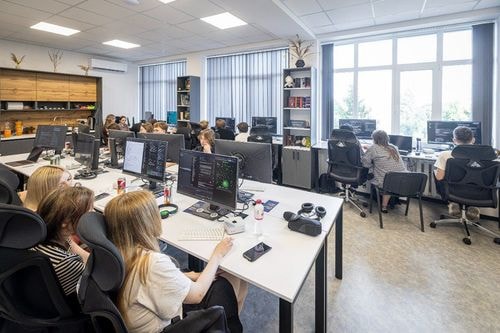 Hackathon participants working at computers in the laboratory
